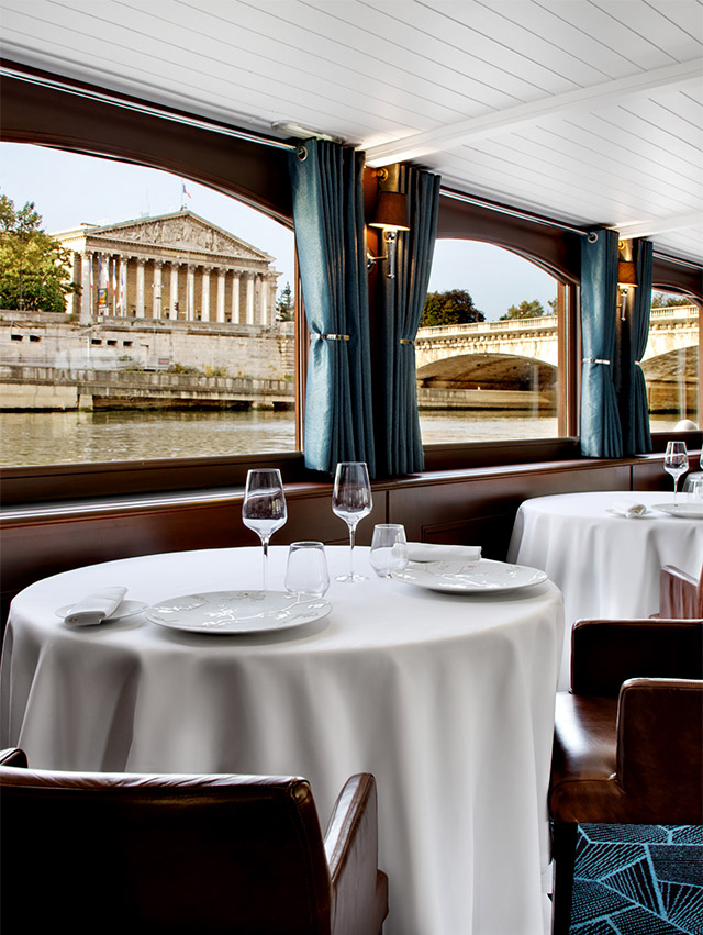 View on the Seine from a table of a restaurant cruise Bateaux Parisiens
