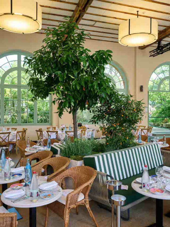 The interior of the cozy and elegant area of the Orangerie and its tables at Roland-Garros