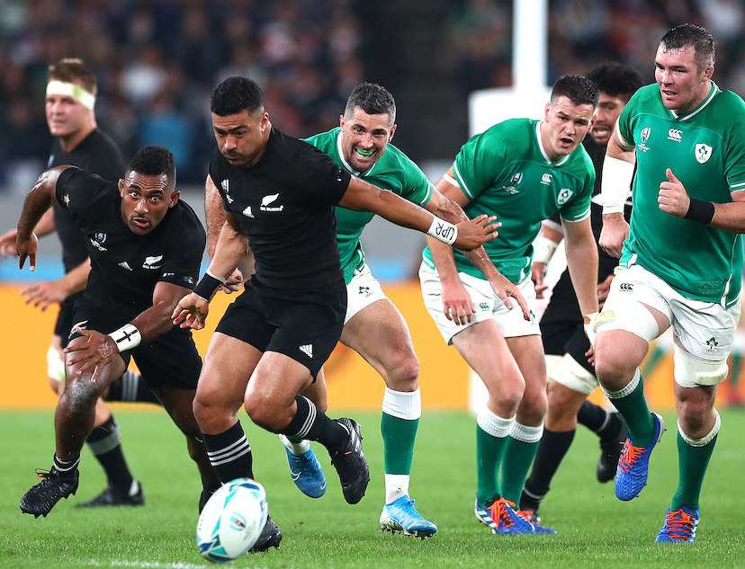 Rugby players from the Ireland and New Zealand teams on the pitch during a Rugby World Cup match