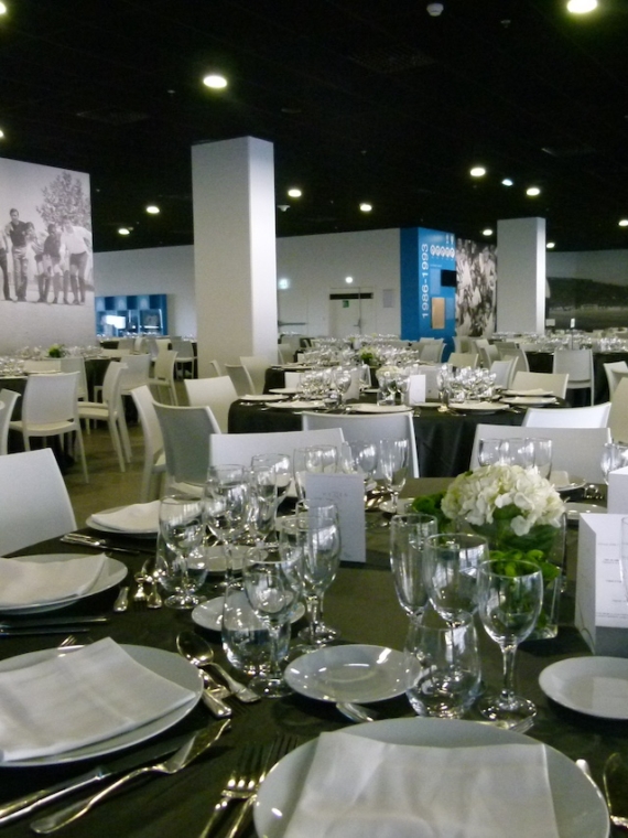 The Salon Partagé at the Orange Velodrome of Marseille and its tables for a seated dinner during a VIP hospitality experience with Sodexo Live Hospitality