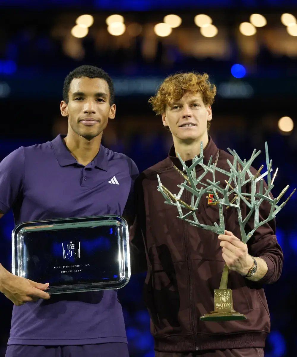 Jannik Sinner and Félix Auger‑Aliassime posing with their trophies during the award ceremony at the Rolex Paris Masters in Paris La Défense Arena, a highlight moment enhanced by the VIP Sodexo Live! hospitality experience.