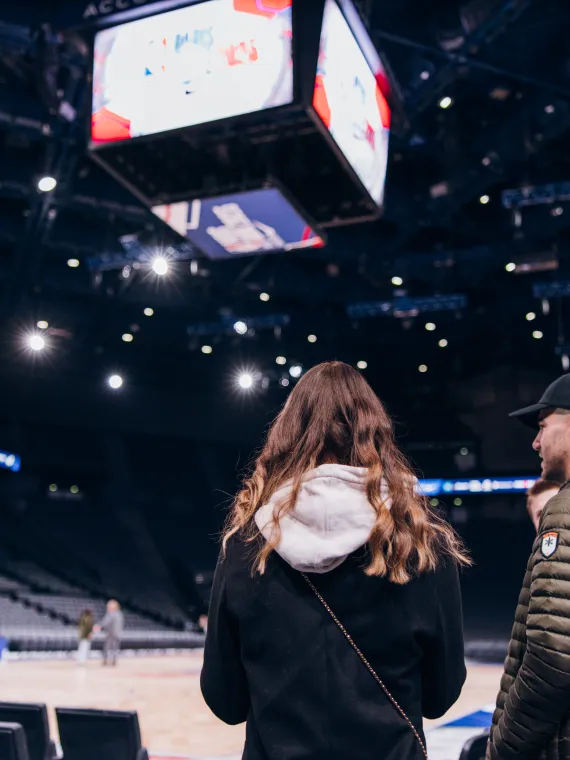 Two people acccessing the game floor before the game