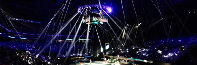 Paris La Défense Arena illuminated during a pre‑match show at the Rolex Paris Masters, creating a spectacular atmosphere enhanced by Sodexo Live! VIP hospitality experiences.