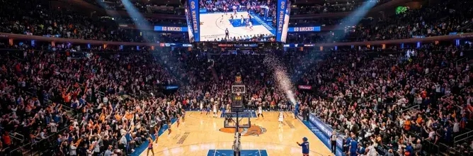Inside Madison Square Garden during an NBA game, reflecting the vibrant atmosphere offered through Sodexo Live! Hospitality’s premium New York trips.