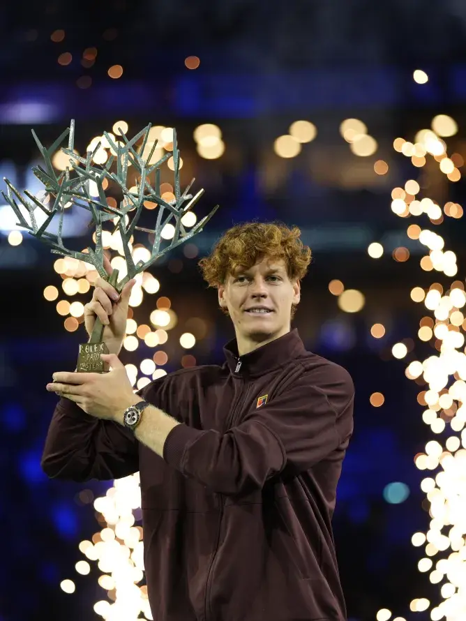 Jannik Sinner lifts the Rolex Paris Masters trophy at Paris La Défense Arena, celebrating his victory during a premium event enhanced by Sodexo Live! VIP hospitality packages.