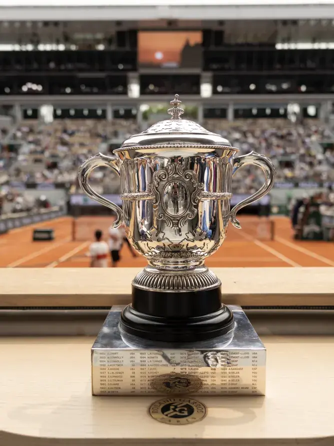 Roland-Garros women’s trophy highlighted, symbolizing the prestige associated with the VIP experiences offered by Sodexo Live! Hospitality.