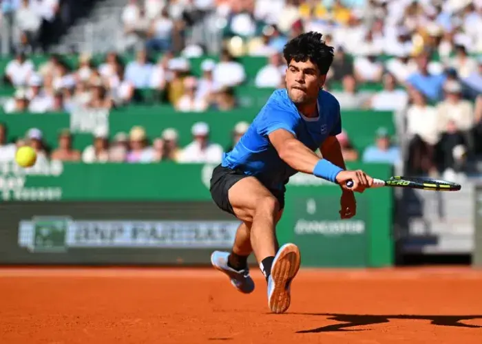 Carlos Alcaraz in action during the final of the Rolex Monte-Carlo Masters, focused and composed during a rally, highlighting the premium atmosphere of the Sodexo Live! Hospitality VIP experience.